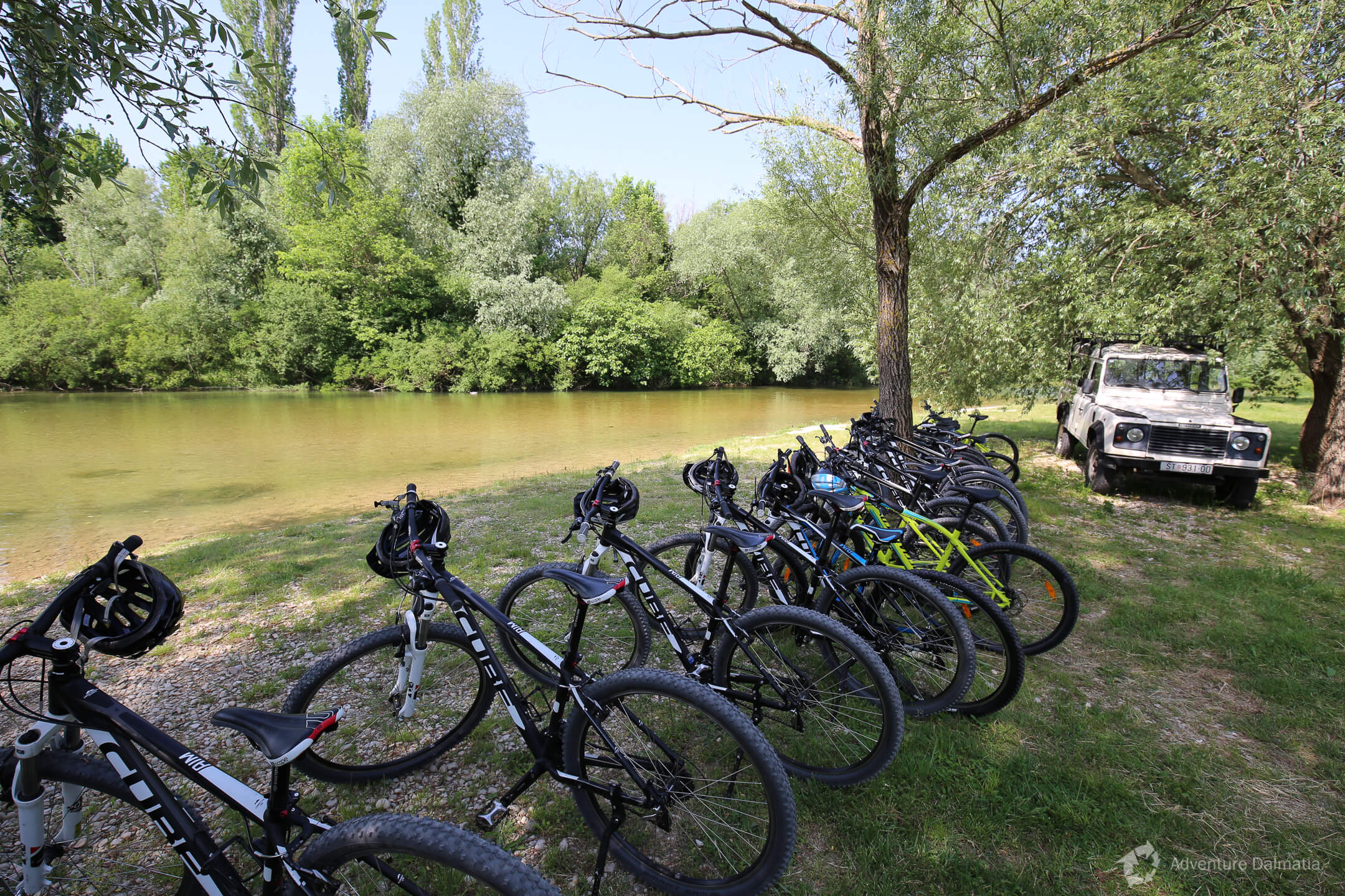 Bicycles on a meadow by Cetina river; Split Adventure biking excursions