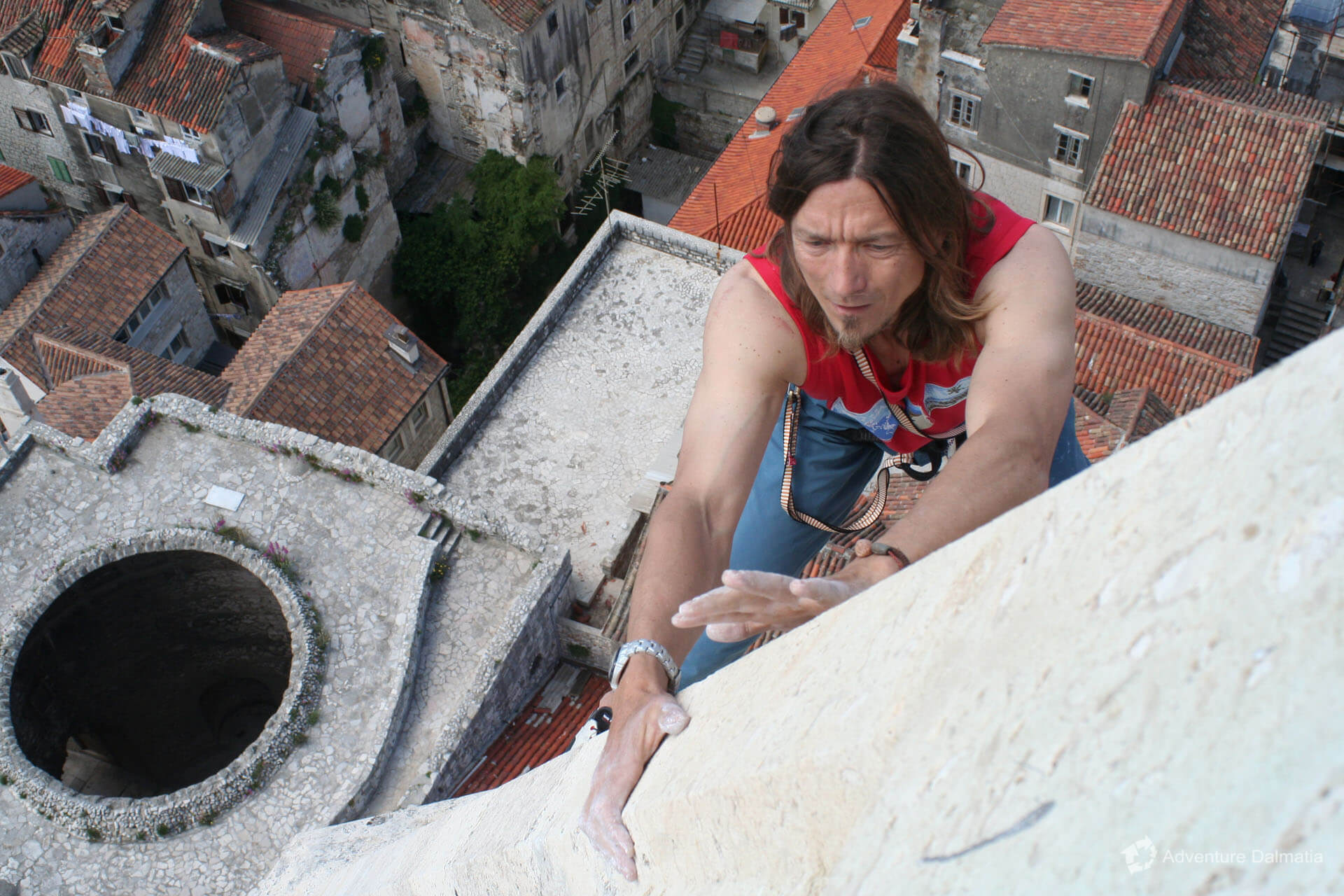 Croatian climber Ivica Matković climbs to the top of the 60m bell tower of Splits patron St Domnius.