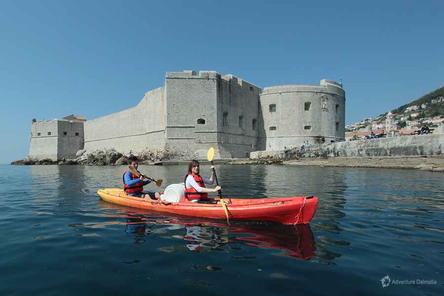Sea kayaking around Dubrovnik city walls, fortress St Ivan.